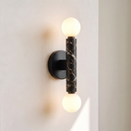 Baton Dual Globe Sconce - Nero Portoro, a black circular backplate, a central black marble cylinder with gold veining, and two matte white spherical shades on either end | IINK Interiors