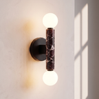 Baton Dual Globe Sconce - Rosso Levanto- two glowing white globe bulbs and a central dark marble column | IINK Interiors