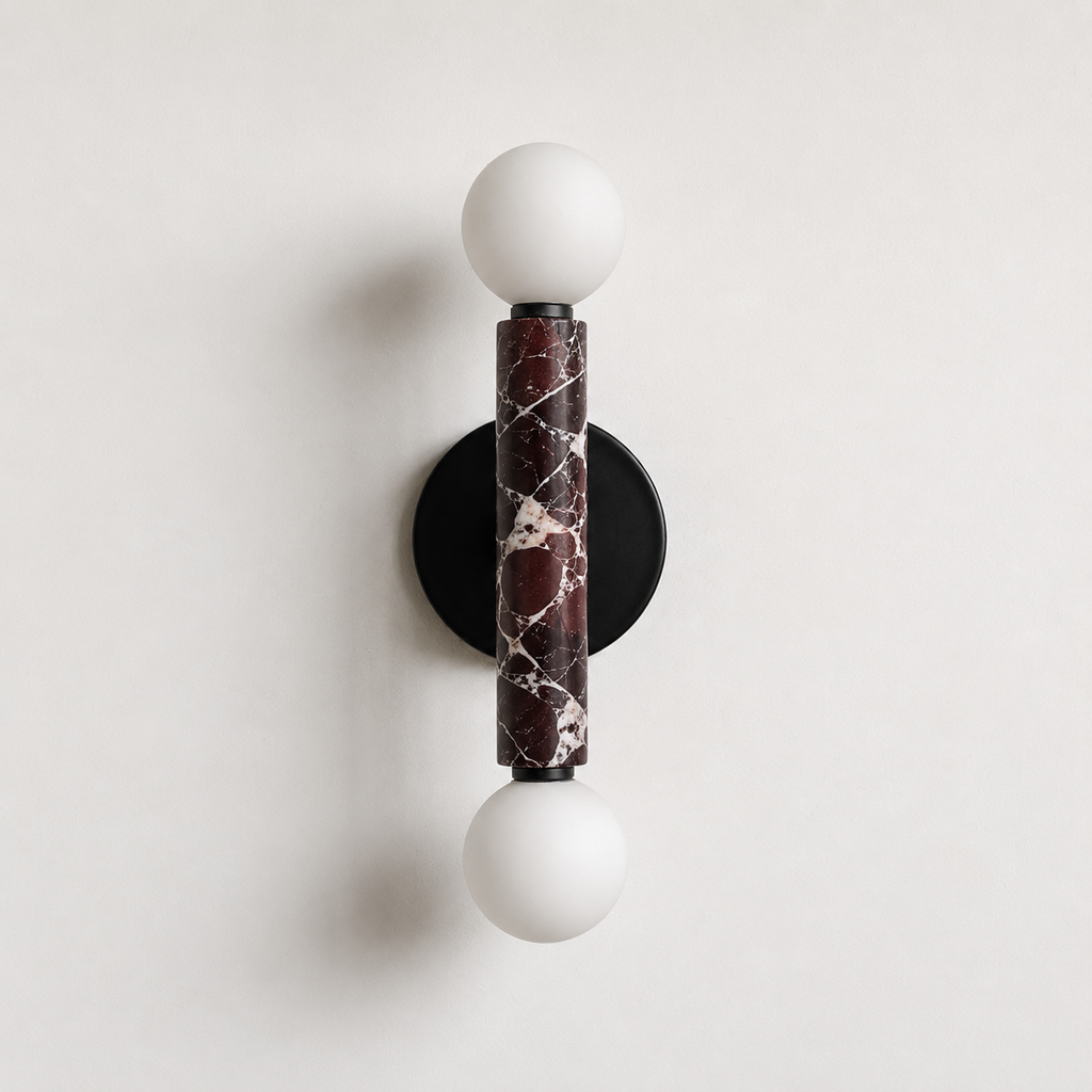 Baton Dual Globe Sconce - Rosso Levanto- two glowing white globe bulbs and a central dark marble column | IINK Interiors