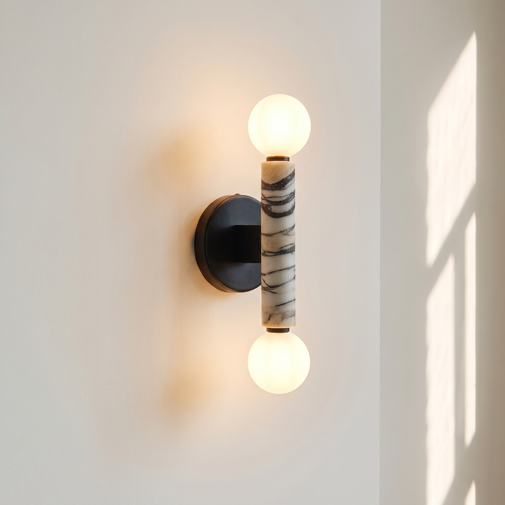 Baton Dual Globe Sconce - Calacatta, a black circular backplate, a central marble cylinder with gold veining, and two matte white spherical shades on either end | IINK Interiors