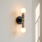 Baton Dual Globe Sconce - Calacatta, a black circular backplate, a central marble cylinder with gold veining, and two matte white spherical shades on either end | IINK Interiors