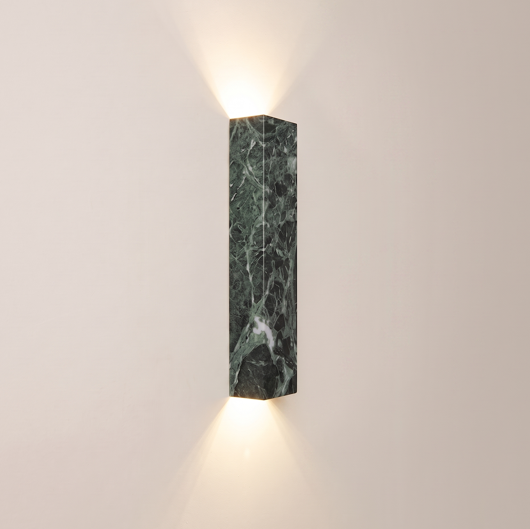A Verdi Alpi Marble Sconce with matte finish, this rectangular wall light adds a touch of sophistication to living rooms | IINK Interiors