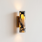 Up and down tube Sconce - Calacatta Viola- A modern wall-mounted sconce with a cylindrical marble shade featuring black and cream veining | IINK Interiors