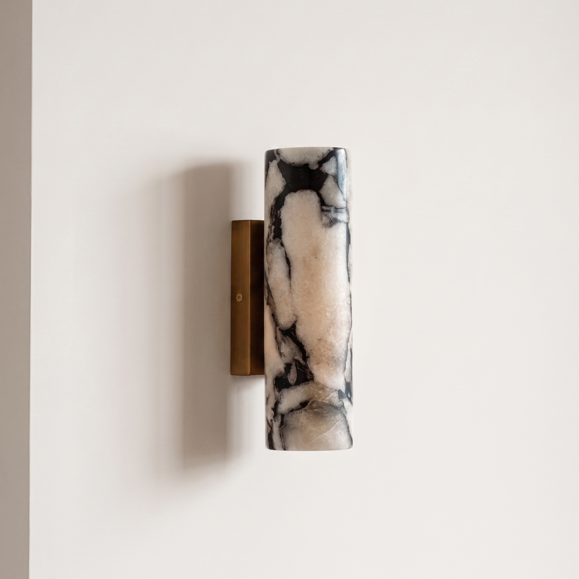 Up and down tube Sconce - Calacatta Viola- A modern wall-mounted sconce with a cylindrical marble shade featuring black and cream veining | IINK Interiors
