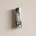 Up and down tube Sconce - Calacatta Viola- A modern wall-mounted sconce with a cylindrical marble shade featuring black and cream veining | IINK Interiors