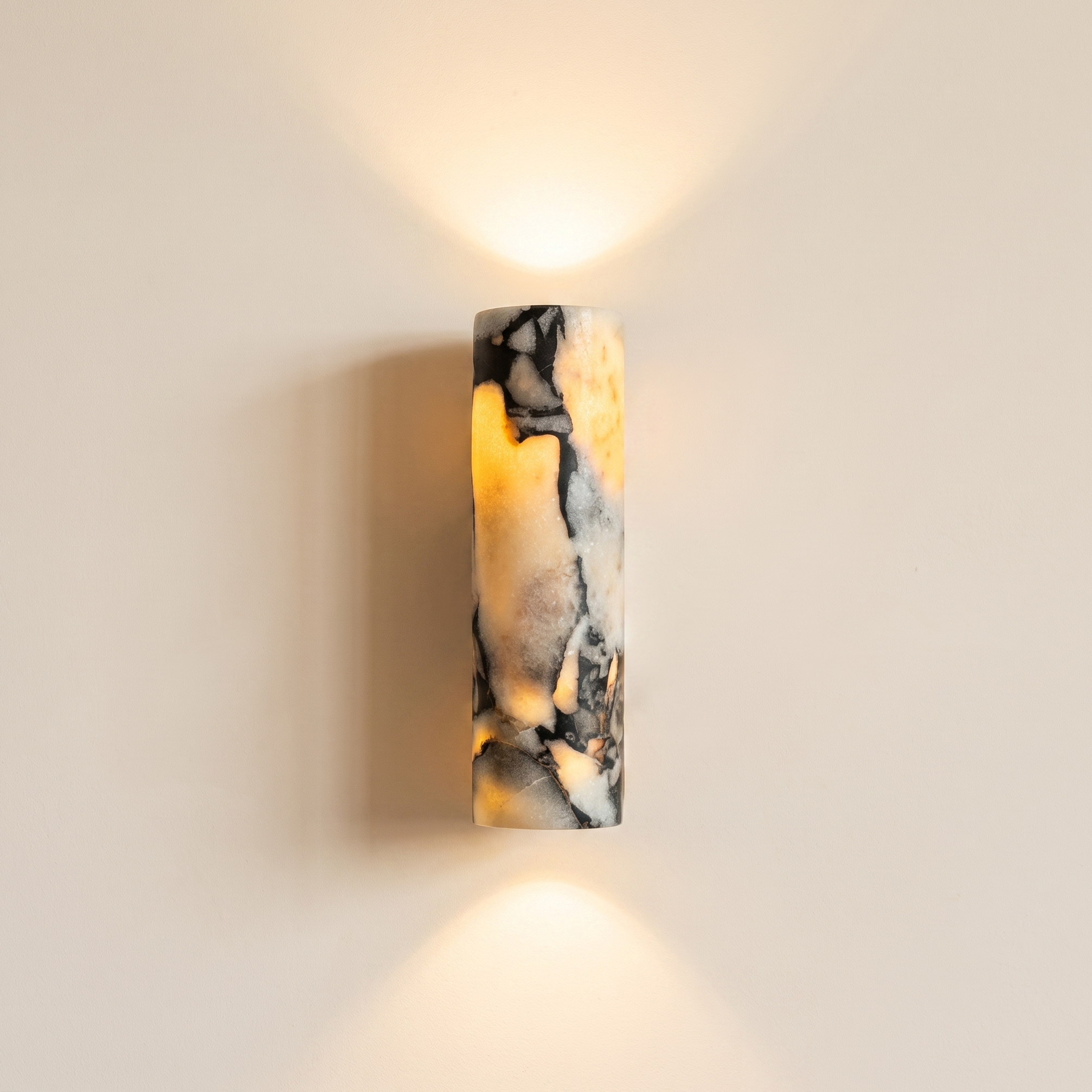 Up and down tube Sconce - Calacatta Viola- A modern wall-mounted sconce with a cylindrical marble shade featuring black and cream veining | IINK Interiors