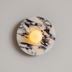 Tondo Planar Sconce - Calacatta Viola- A round white marble candle holder with dramatic black and dark brown veining | IINK Interiors