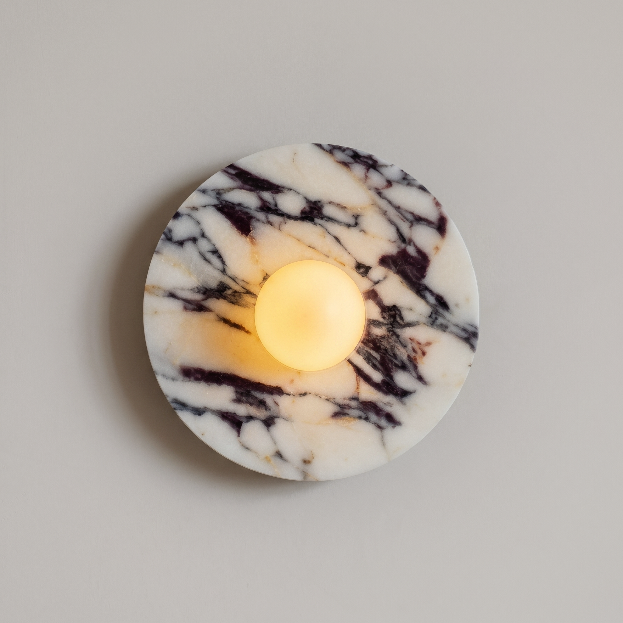 Tondo Planar Sconce - Calacatta Viola- A round white marble candle holder with dramatic black and dark brown veining | IINK Interiors