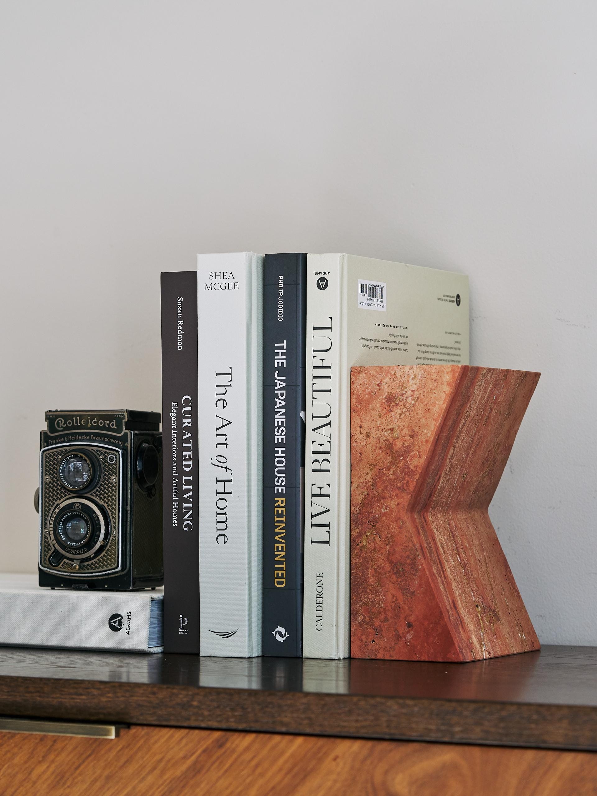 The V Book Stand - Travertine Rosso